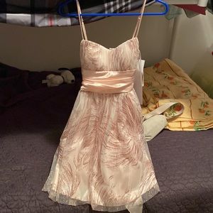 Peach/Pink Dress with Sparkles and Readjustable Bow. Size 7/8 but fits Small.